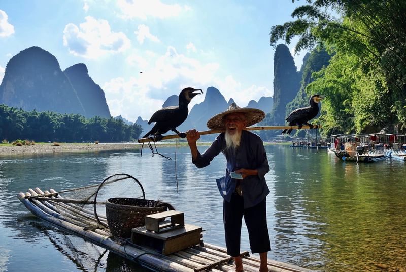 追寻20元国夷易近币上的漓江渔翁 — 新京报